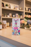 New Acrylic Crystal guardian angel sun catcher and car charm, featuring a colourful beaded strand, floral-patterned acrylic wings, and a faceted crystal prism, dark pink hanger