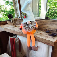 New Fall themed gnome plush shelf sitter holding Harvest Sign with weighted beanbag body and dangling legs by Giftcraft! 11 inch