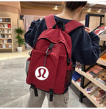 New DUPE LU LU Inspired Backpack with large logo! Great quality! Tons of room to hold all of your essentials! Burgundy/Maroon colour