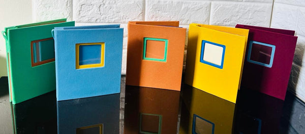 5 piece colours photo frames, holds 20 photos each album