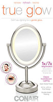 New in box! Conair True Glow Satin Nickel Oval Lighted Mirror! Double sided 1x/7x magnification, produces a soft halo, gentle glow!