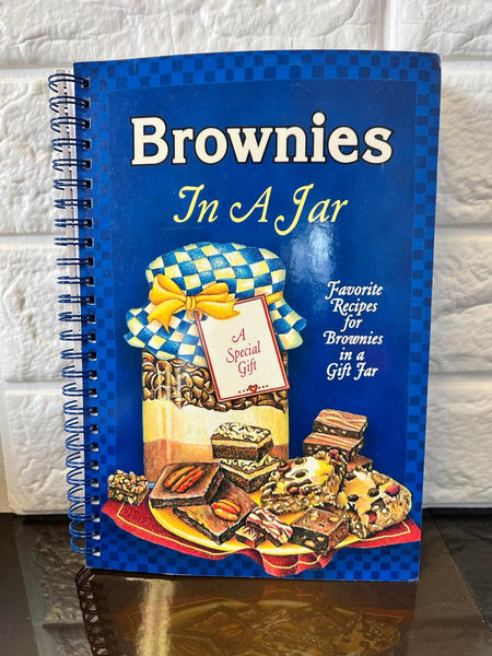 New brownies in a jar paperback coil bound! Each Jar Recipe Has 6 Tags for the Jar which include baking instructions! Perfect Book for Gift Giving Ideas!