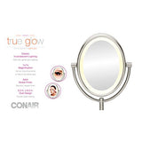 New in box! Conair True Glow Satin Nickel Oval Lighted Mirror! Double sided 1x/7x magnification, produces a soft halo, gentle glow!
