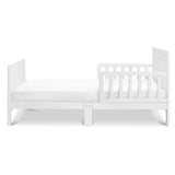 New in box! New Zealand Pine DaVinci Modena Toddler Bed in White! Mattress NOT Included! Note: 1 Footboard leg has paint chips could touch up with paint!