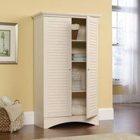 Brand new in box! Great Quality Sauder Woodworking Company Harbor View Storage Cabinet in Antique White! 4 Adjustable Shelves, 1 full upper shelf! Retails $499+