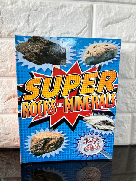 Super Rocks and Minerals, Hardcover Kit! Includes 4 rock samples: magnetite, pyrite, pumice, and dolomite, as well as a compass, magnifying glass, and dropper.