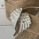 Anything is possible when you have wings! Wing Necklace, accented with diamond faceting and cubic zirconias, includes gift box with verse